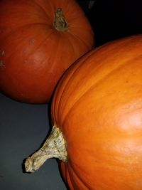 Close-up of pumpkin against orange background