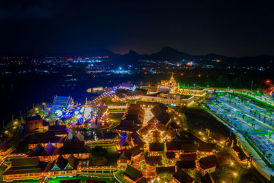 High angle view of illuminated buildings in city at night