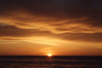 View of calm sea at sunset