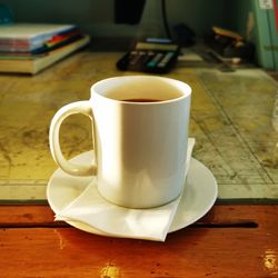 Close-up of coffee cup on table