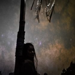 Low angle portrait of silhouette woman standing against sky at night