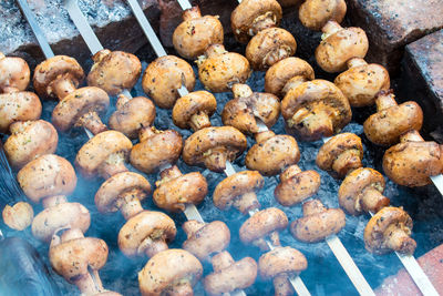 Delicious champignon mushrooms fried on a grill