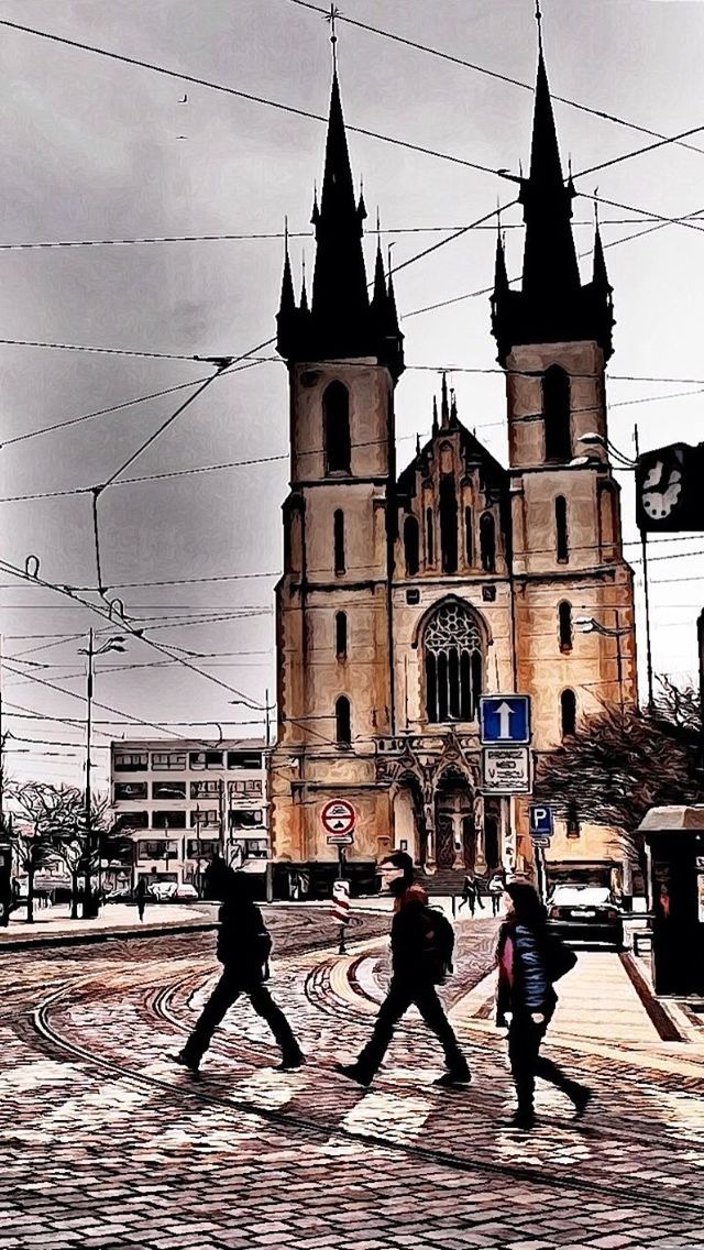 building exterior, architecture, built structure, street, church, men, sky, walking, place of worship, religion, lifestyles, person, cobblestone, spirituality, transportation, incidental people, city