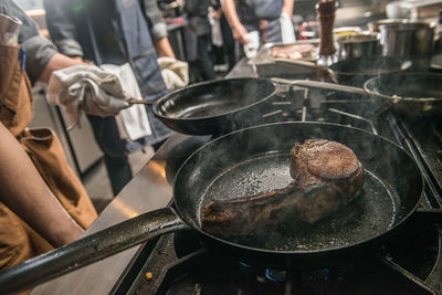 High angle view of meat cooking on barbecue grill