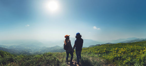 Rear view of man standing on mountain