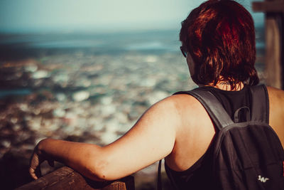 Rear view of woman looking at sea