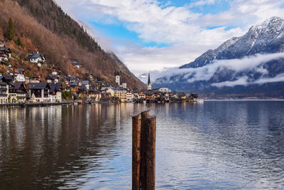 Scenic view of sea and buildings against sky