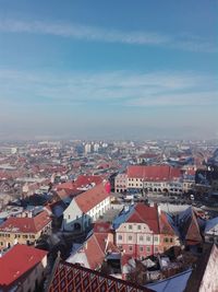 Aerial view of cityscape against sky