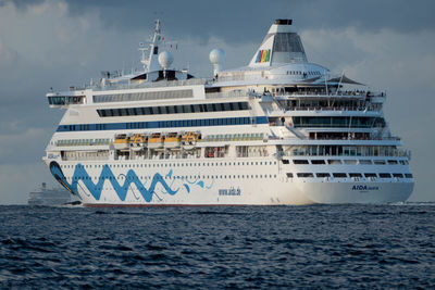 Ship sailing in sea against sky