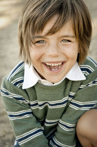 Portrait of smiling boy playing outdoors