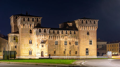 Buildings in city at night