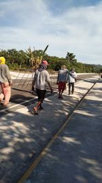 People walking on road in city