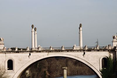 Bridge over river against clear sky