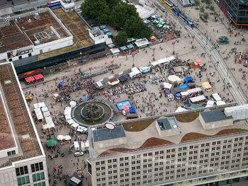 From the berlin tv tower cityscape. overcrowded people walking in the square