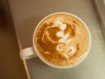 High angle view of cappuccino on table