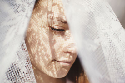 Close-up of woman wearing veil