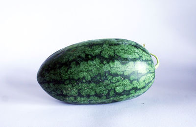 Close-up of fruit against white background