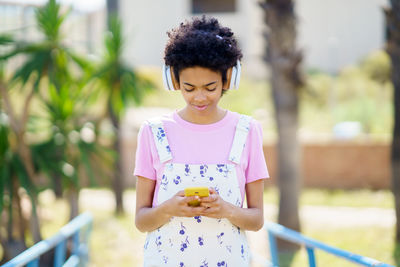 Girl listening music on headphones