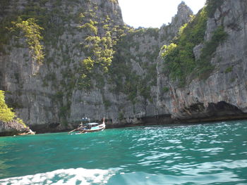 Scenic view of sea with mountains in background