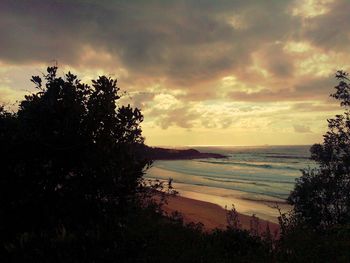 Scenic view of sea against cloudy sky