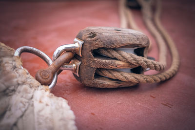 Close-up of rusty tied up on metal chain