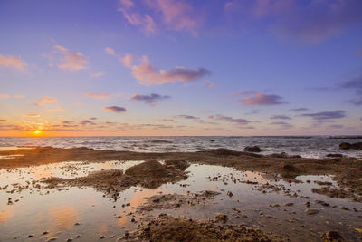 Scenic view of sea against sky during sunset