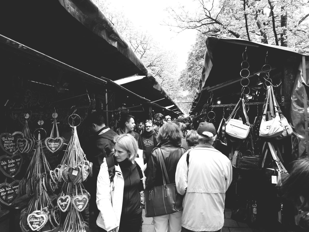 real people, standing, retail, outdoors, large group of people, men, day, market, women, tree, people