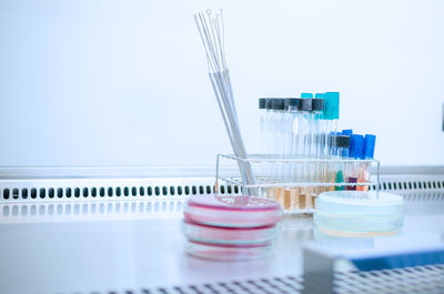 Close-up of glass table against white background