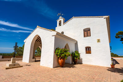 Entrance of building against blue sky