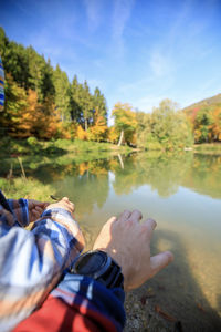Reflection of trees in lake against sky