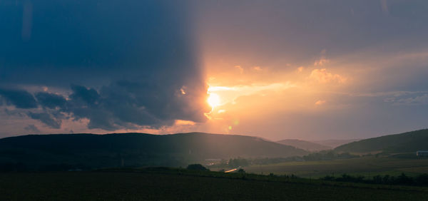 Scenic view of silhouette landscape against sky during sunset