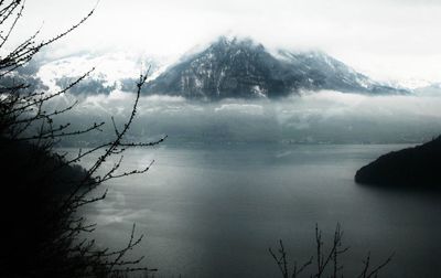 Scenic view of lake with mountains in background