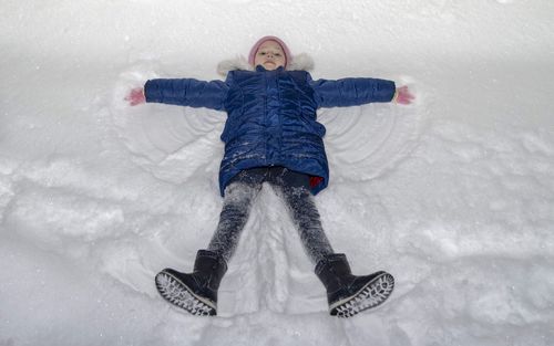 Full length of senior woman in snow