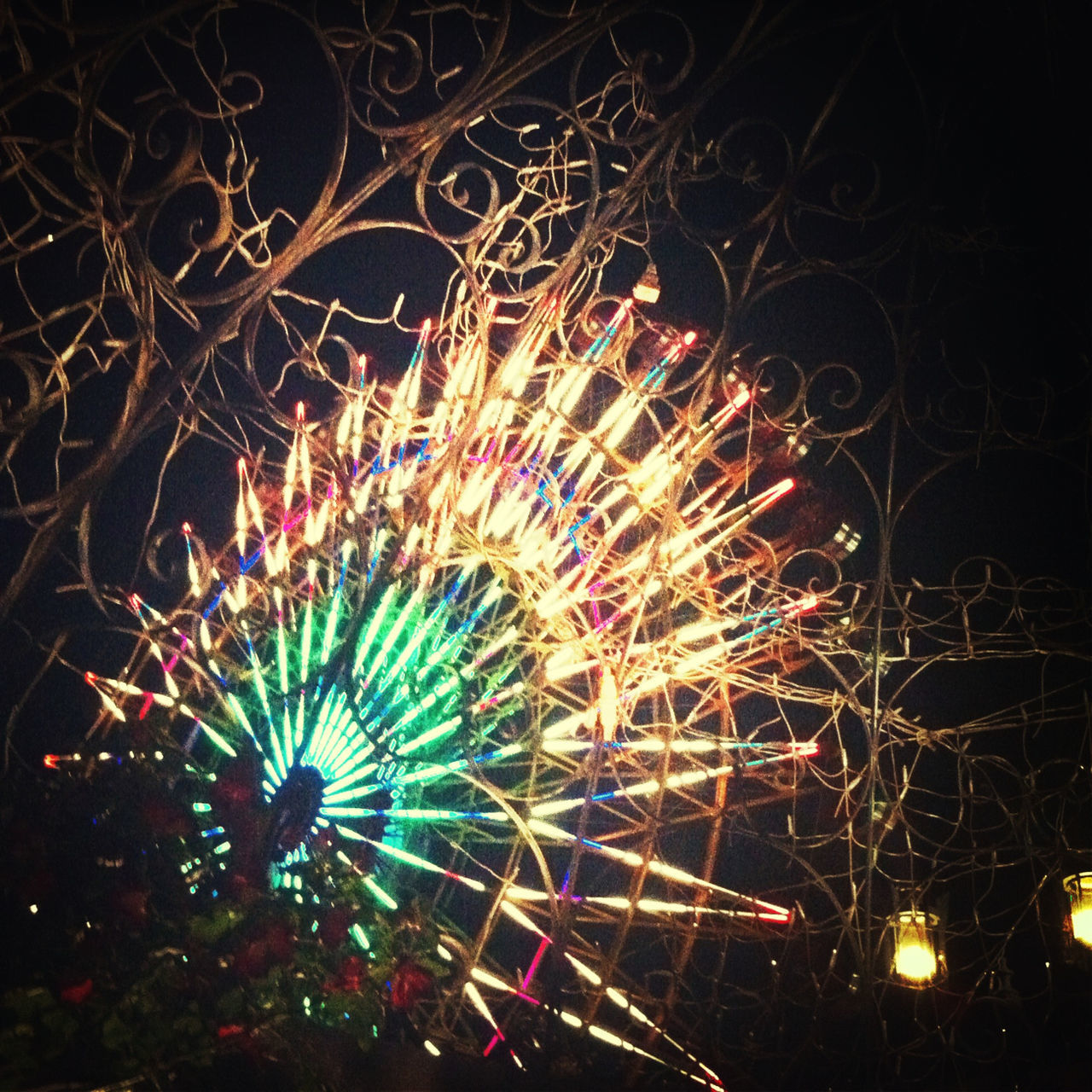 night, illuminated, arts culture and entertainment, celebration, long exposure, firework display, low angle view, glowing, firework - man made object, exploding, motion, sky, multi colored, event, sparks, entertainment, blurred motion, ferris wheel, amusement park, firework