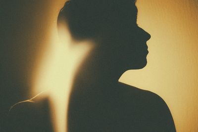Shadow of silhouette woman standing on floor