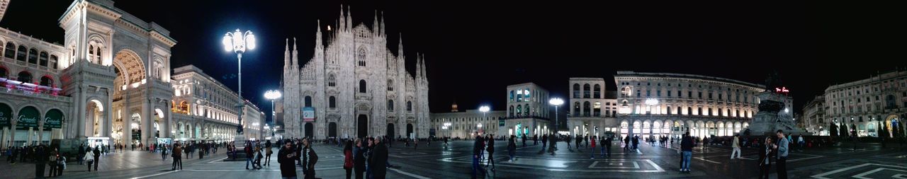Illuminated city against sky at night