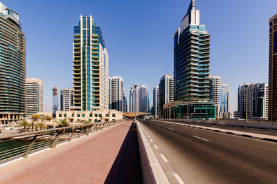 Modern buildings in city against clear sky