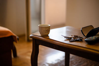 Close-up of coffee cup on table