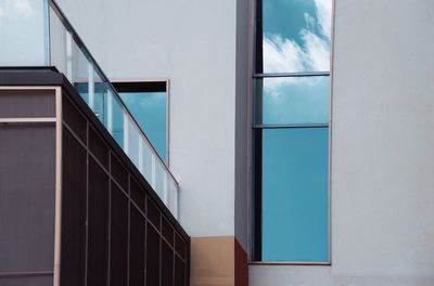 Reflection of building on glass window