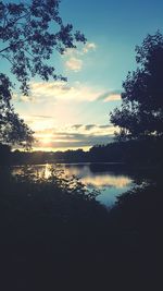 Scenic view of lake at sunset