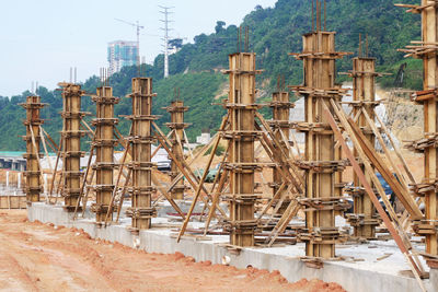 Construction site against sky in city