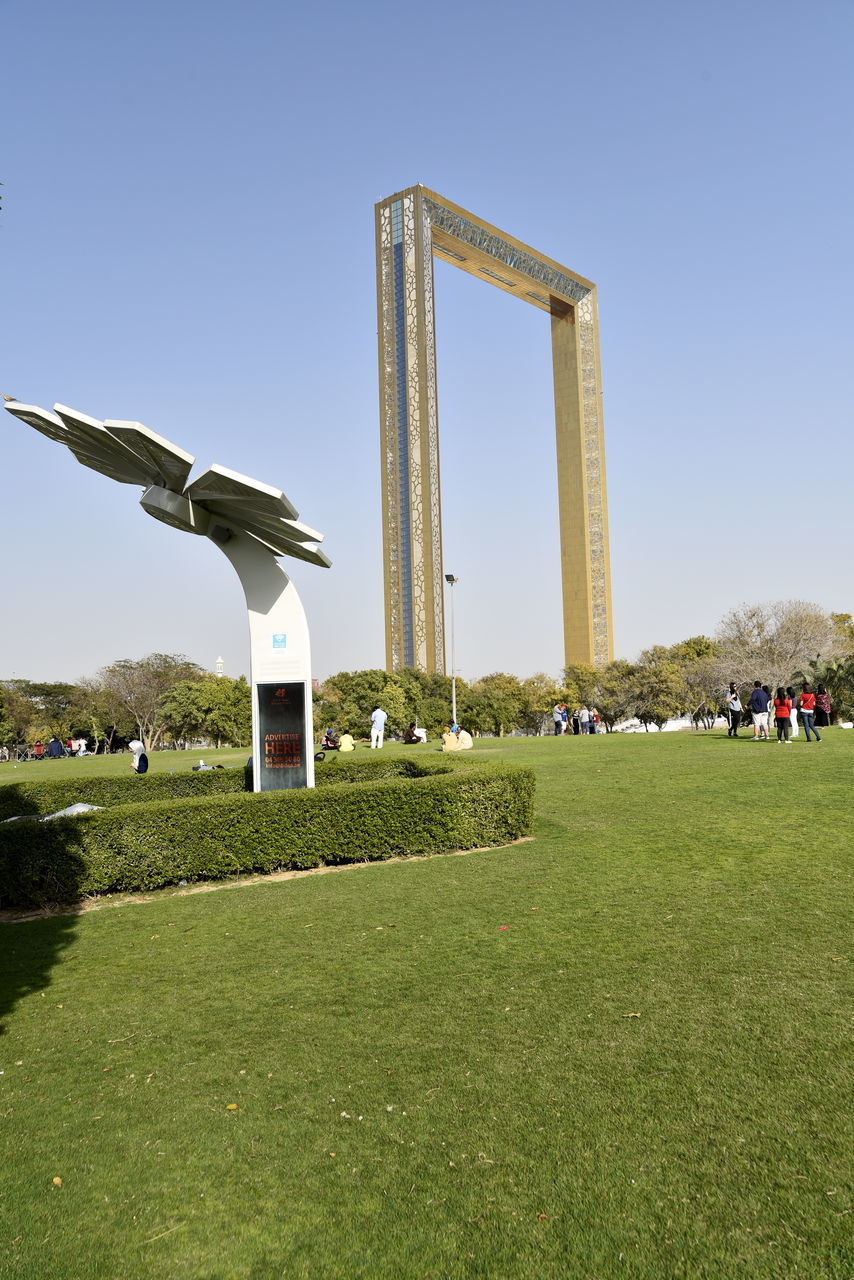 VIEW OF WINDMILL ON FIELD AGAINST SKY