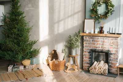 Modern concept of christmas interior design. cozy living room decorated with a wreath, a christmas 