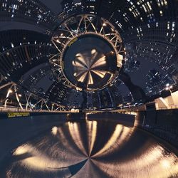 Illuminated ferris wheel at night