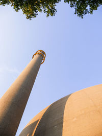 Low angle view of smoke stack against sky