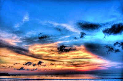 Scenic view of sea against cloudy sky