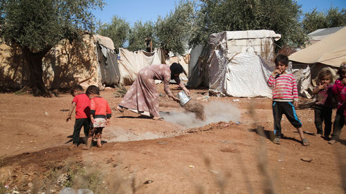 Syrian children inside their tent in the middle of a refugee camp near the turkish border.