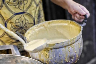 Close-up of person preparing food