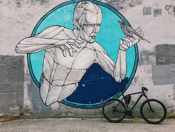 Graffiti on bicycle wall