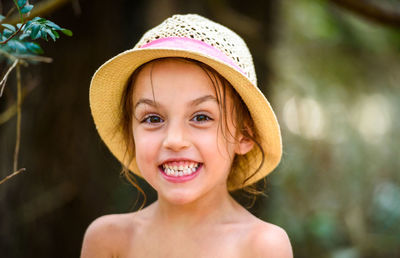 Close-up portrait of shirtless girl